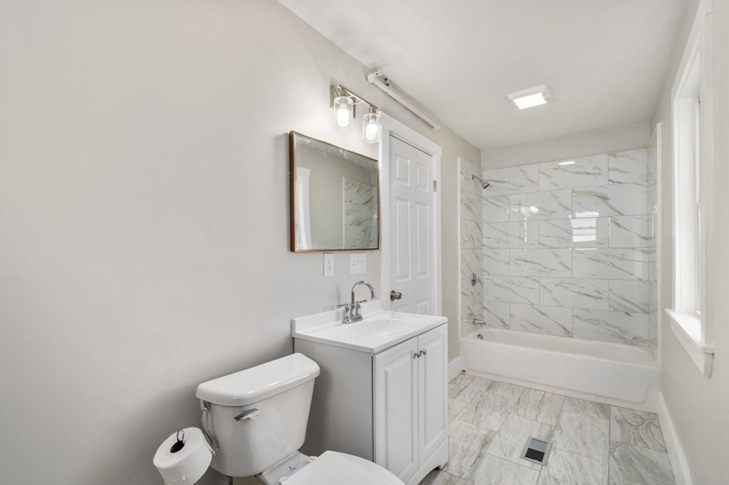 35-41 Watch Street Rochdale, MA 01542 - Photo 36 of 42 a bathroom with a toilet sink and shower