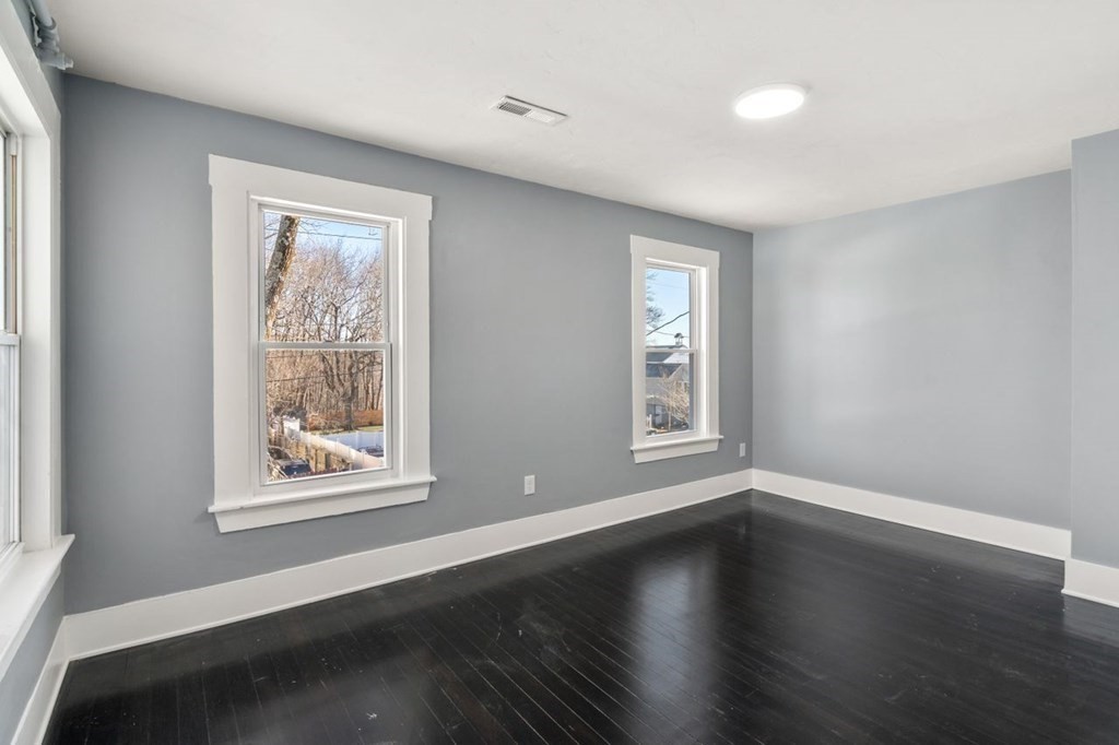 35-41 Watch Street Rochdale, MA 01542 - Photo 38 of 42 a view of an empty room with wooden floor and a window
