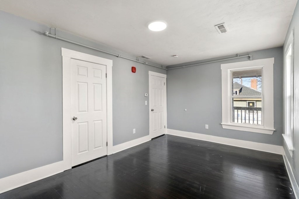 35-41 Watch Street Rochdale, MA 01542 - Photo 39 of 42 an empty room with wooden floor and windows