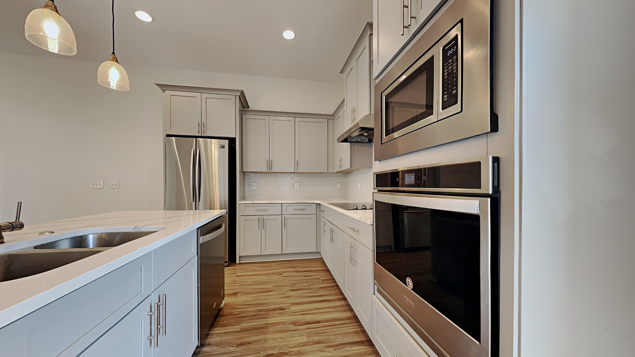 119 Savannah Avenue Pleasant View, TN 37146 - Photo 3 of 9 a kitchen with a refrigerator and a sink