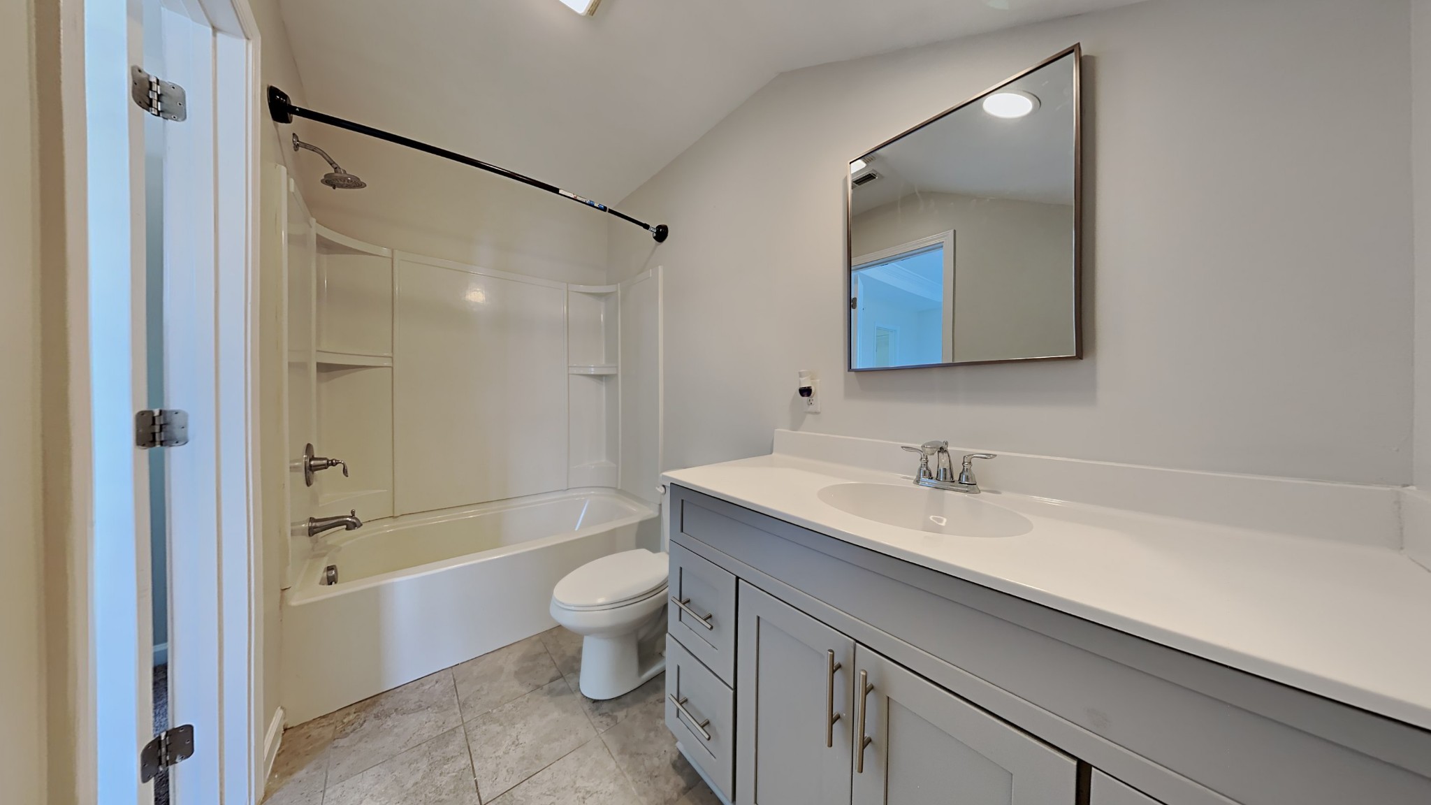 119 Savannah Avenue Pleasant View, TN 37146 - Photo 6 of 9 a bathroom with a bathtub shower sink vanity and toilet