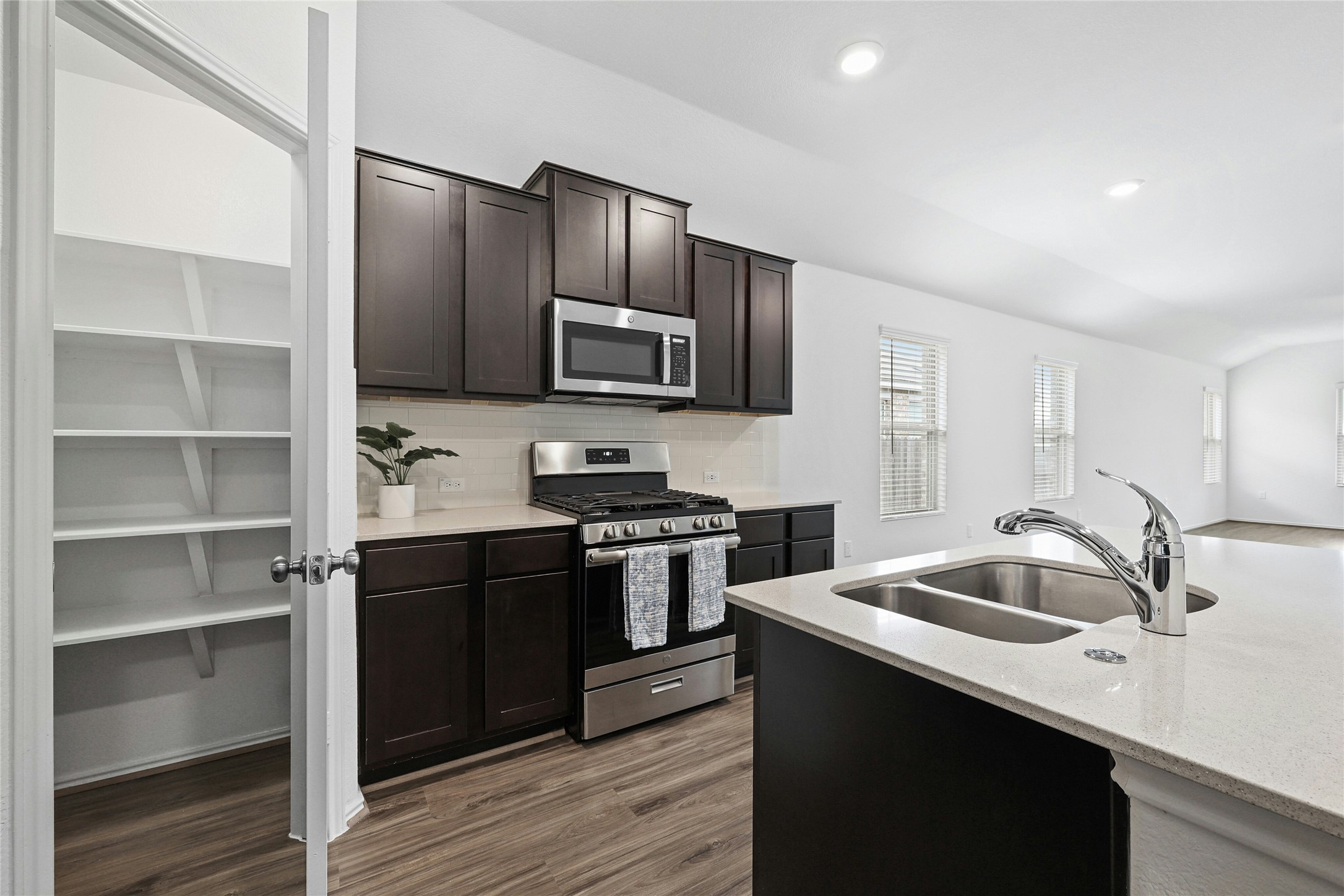 11813 Roscommon Trail Austin, TX 78754 - Photo 19 of 28 a kitchen with a sink appliances and cabinets