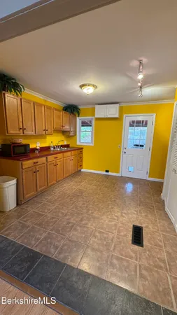 a kitchen with stainless steel appliances granite countertop a stove a sink and a granite counter tops