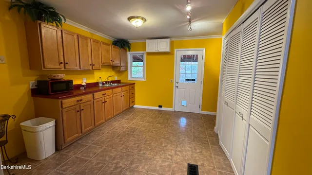 a kitchen with a sink and refrigerator