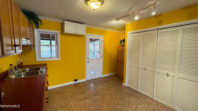 a view of a livingroom with furniture and a flat screen tv