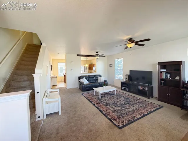 a bedroom with a bed and a television