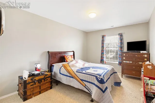 a bedroom with a bed and a table in it