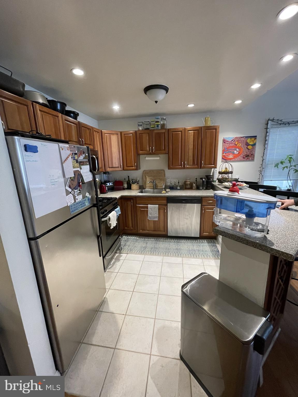 133 South 18th Street, Unit 3F Philadelphia, PA 19103 - Photo 2 of 7 a kitchen with stainless steel appliances granite countertop a refrigerator and a stove