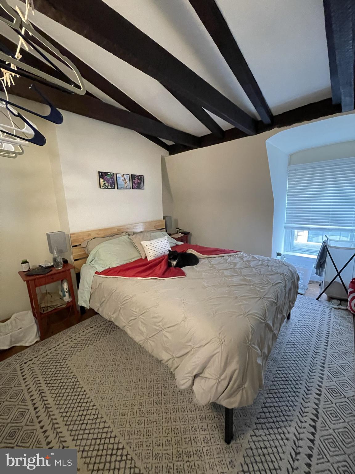 133 South 18th Street, Unit 3F Philadelphia, PA 19103 - Photo 5 of 7 a bed sitting in a bedroom and chair