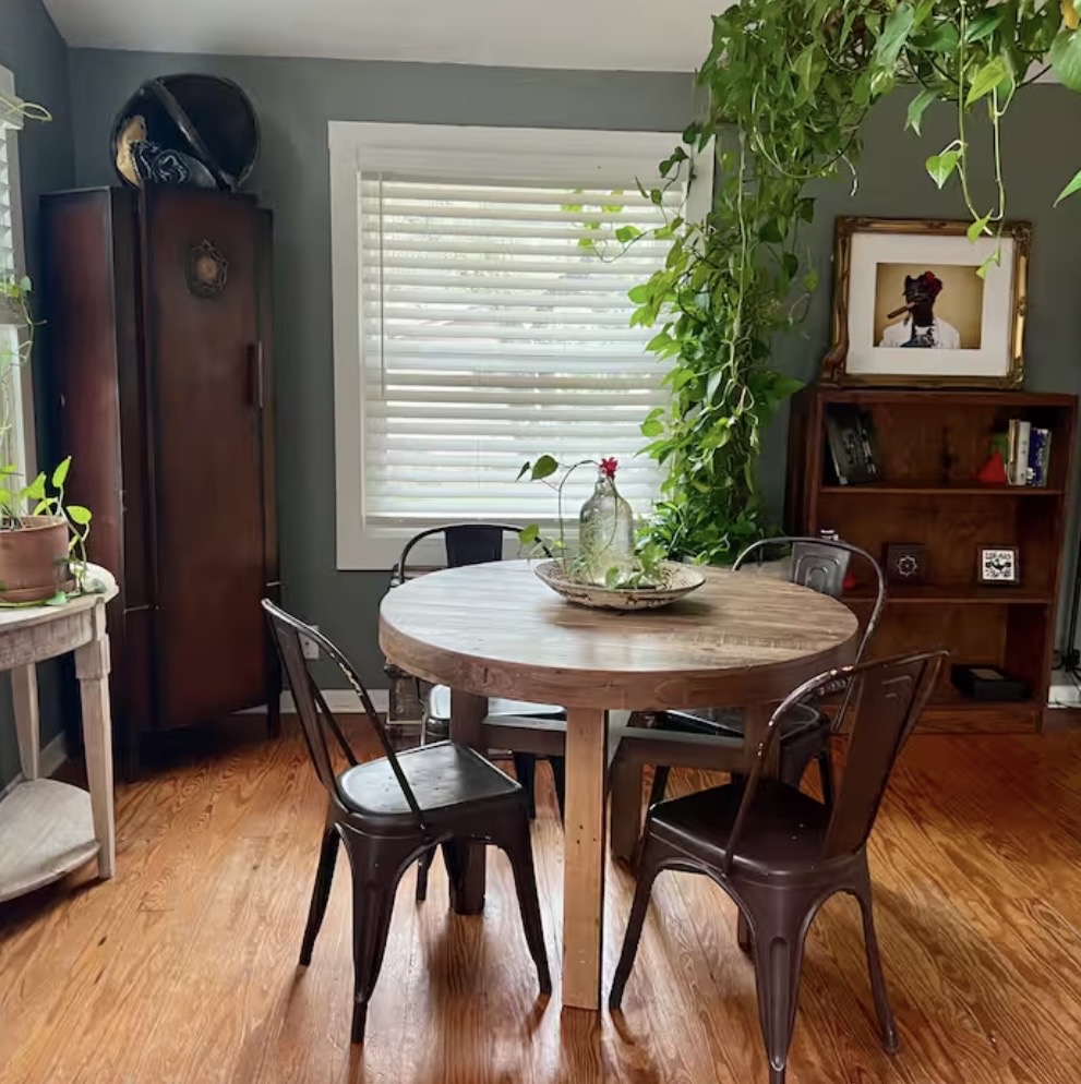 8811 High Valley Road Austin, TX 78737 - Photo 8 of 20 Rich hardwood flooring anchors this cozy dining area framed by a classic wood-trimmed window.