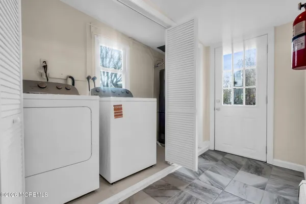 a view of a kitchen and utility room