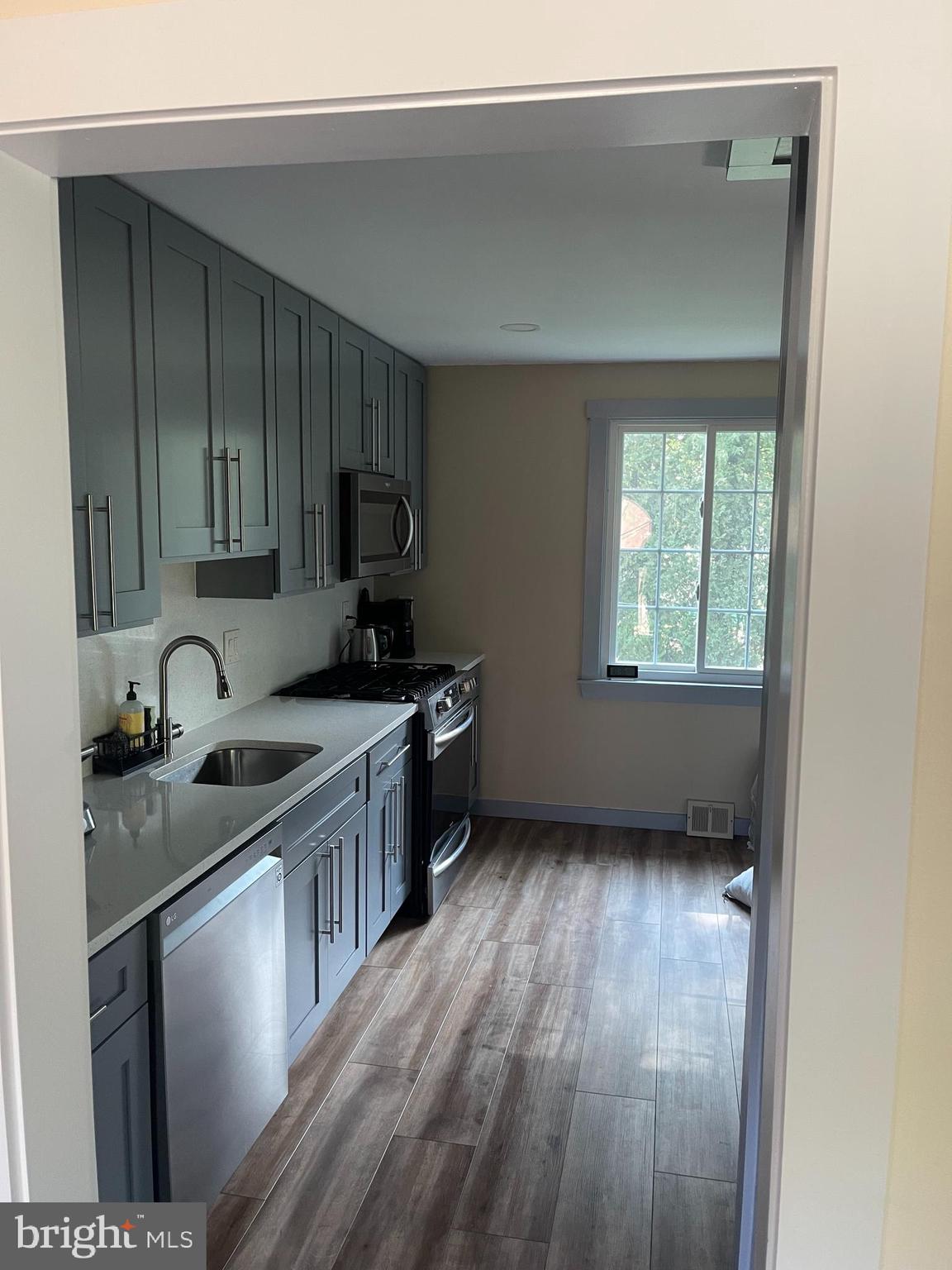 123 Newtown Road Warminster, PA 18974 - Photo 6 of 10 a kitchen with a sink a window and appliances