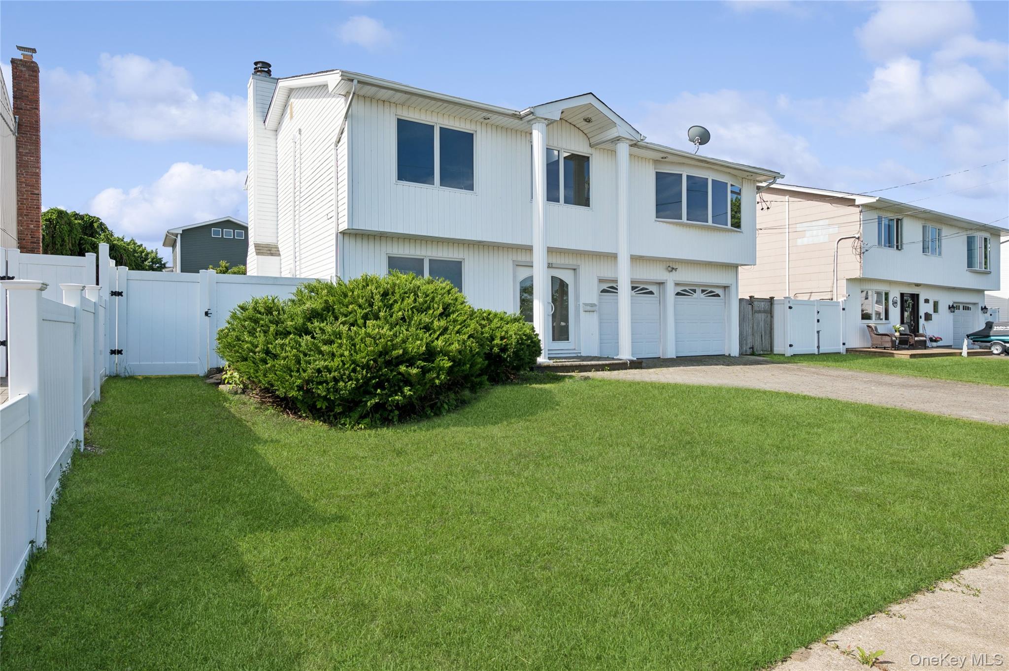 2625 Riverside Drive Wantagh, NY 11793 - Photo 1 of 20 a front view of a house with a yard