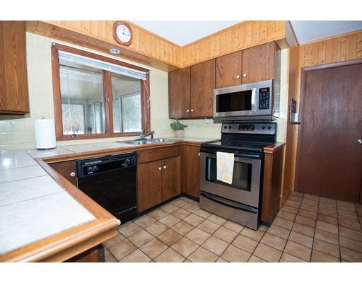 70 Dodge Road Sutton, MA 01590 - Photo 11 of 30 a kitchen with stainless steel appliances granite countertop a stove a sink and a microwave