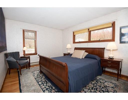 70 Dodge Road Sutton, MA 01590 - Photo 12 of 30 a bedroom with a bed and wooden floor