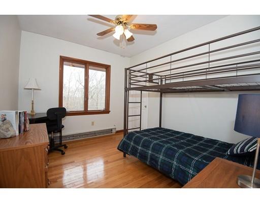 70 Dodge Road Sutton, MA 01590 - Photo 17 of 30 a bedroom with a bed and a chandelier