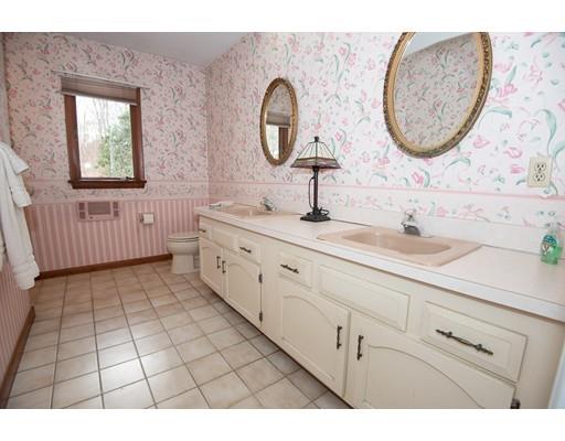 70 Dodge Road Sutton, MA 01590 - Photo 19 of 30 a bathroom with a sink mirror and vanity