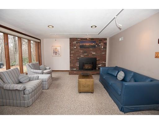 70 Dodge Road Sutton, MA 01590 - Photo 24 of 30 a living room with furniture and a fireplace