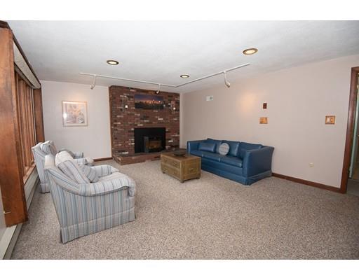 70 Dodge Road Sutton, MA 01590 - Photo 25 of 30 a living room with furniture and a fireplace