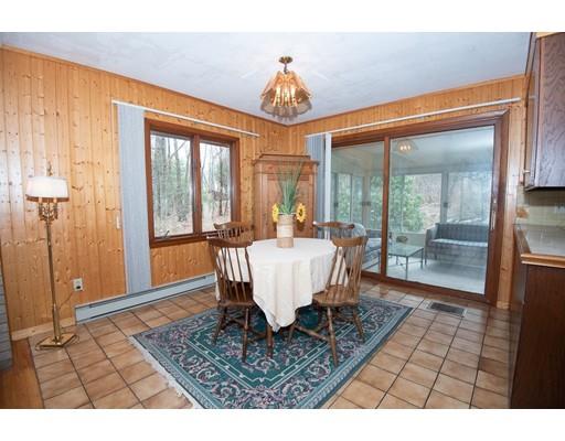 70 Dodge Road Sutton, MA 01590 - Photo 6 of 30 a dining room with a glass top table and chairs