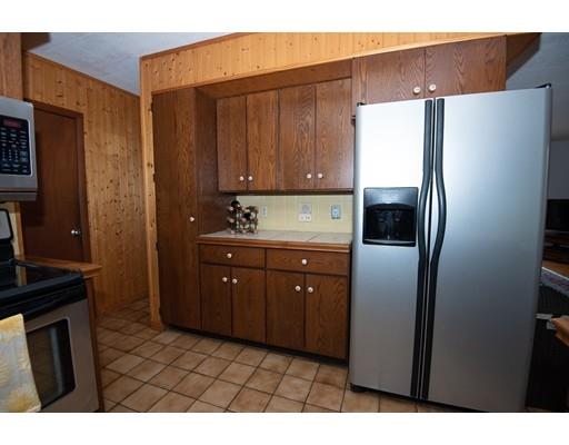 70 Dodge Road Sutton, MA 01590 - Photo 10 of 30 a kitchen with stainless steel appliances a refrigerator and cabinets