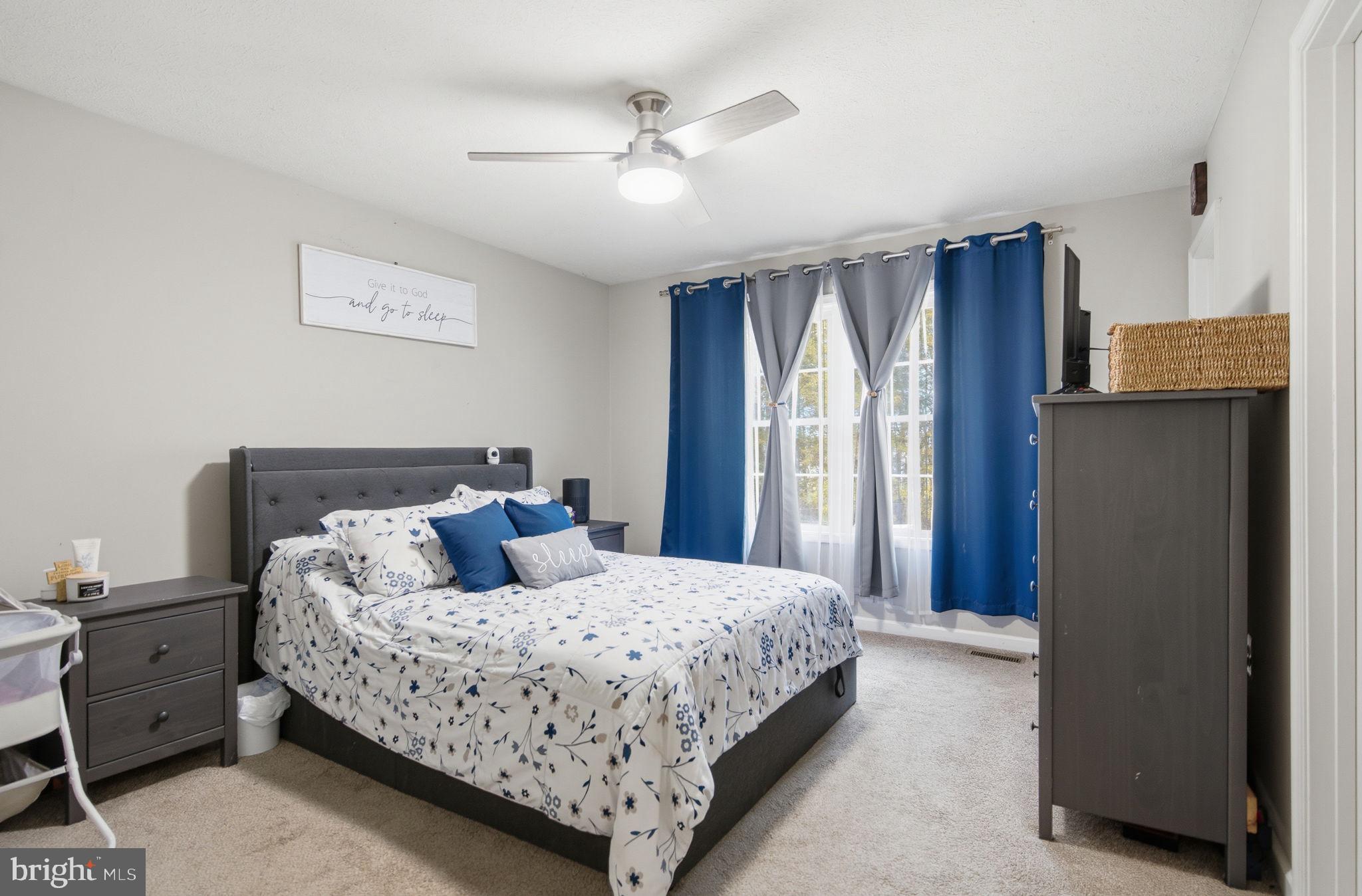 4624 Strasburg Road Strasburg, VA 22657 - Photo 12 of 31 a bedroom with a bed and wooden floor