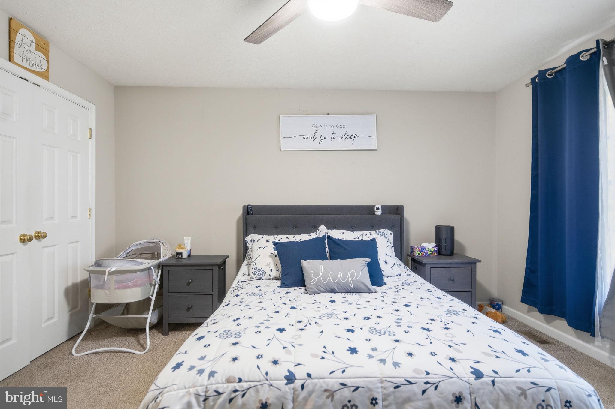 4624 Strasburg Road Strasburg, VA 22657 - Photo 13 of 31 a bedroom with a bed and a chair