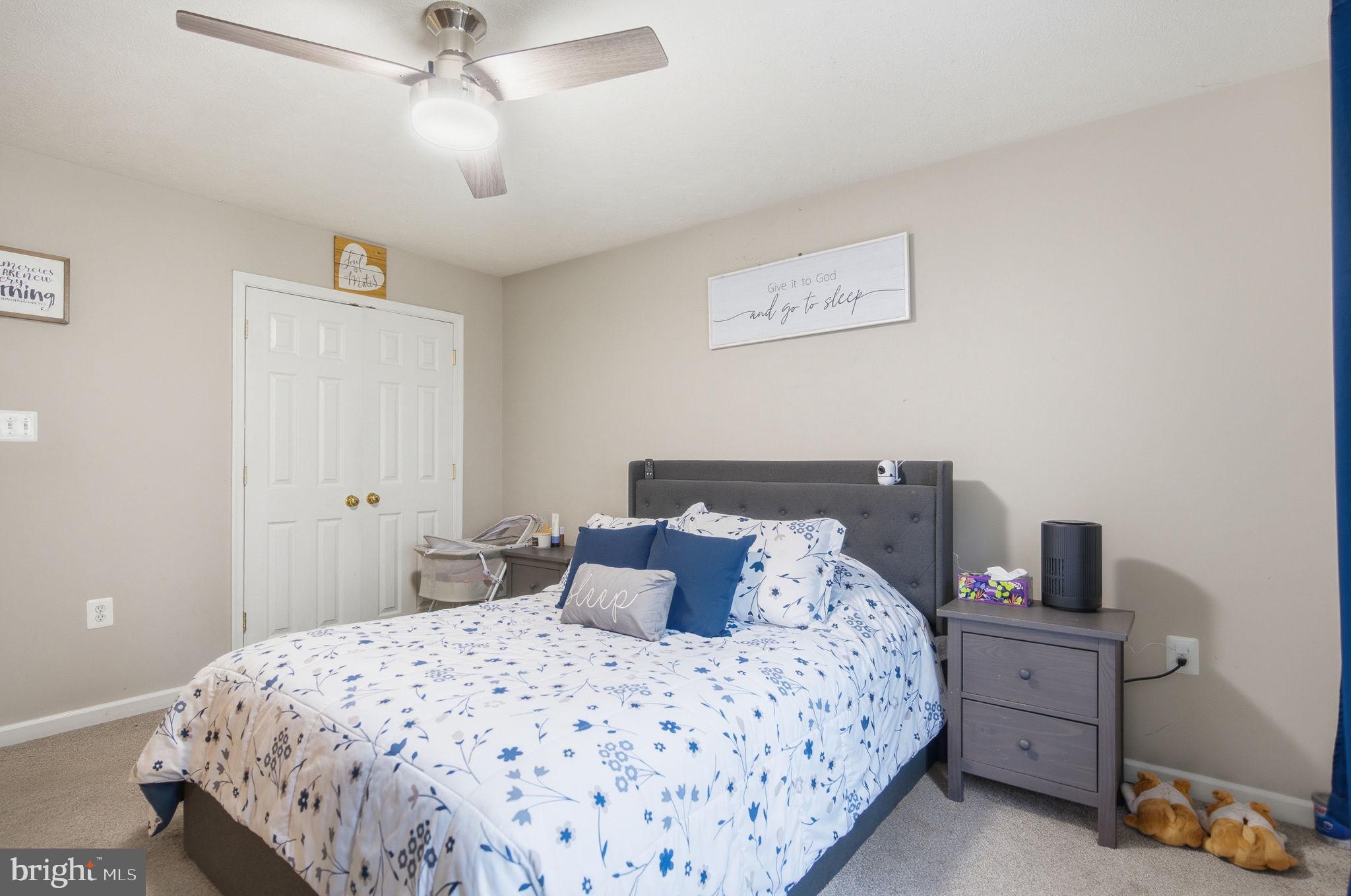 4624 Strasburg Road Strasburg, VA 22657 - Photo 14 of 31 a bedroom with a bed and a lamp on the dresser