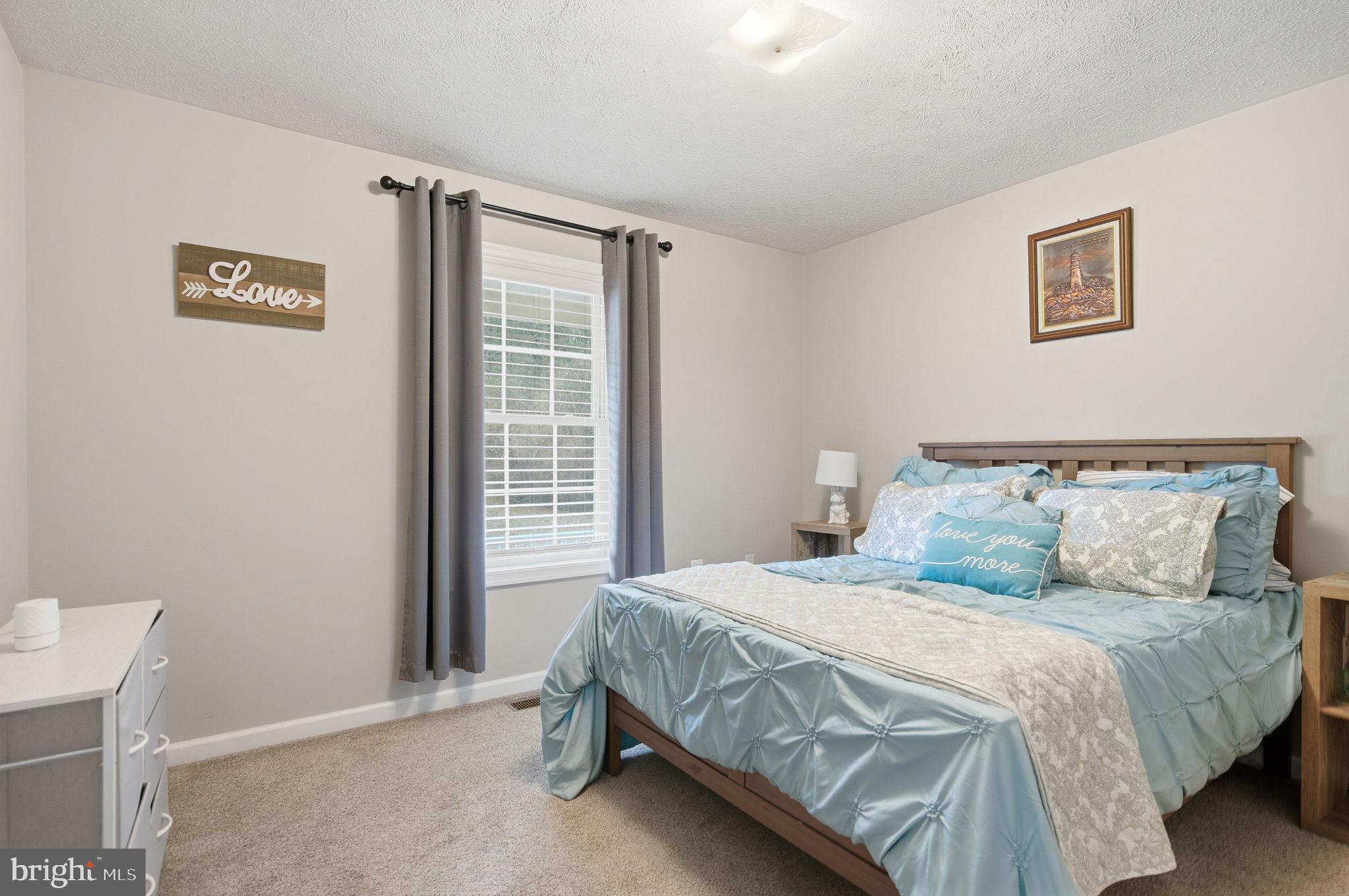 4624 Strasburg Road Strasburg, VA 22657 - Photo 17 of 31 a bedroom with a bed and a window
