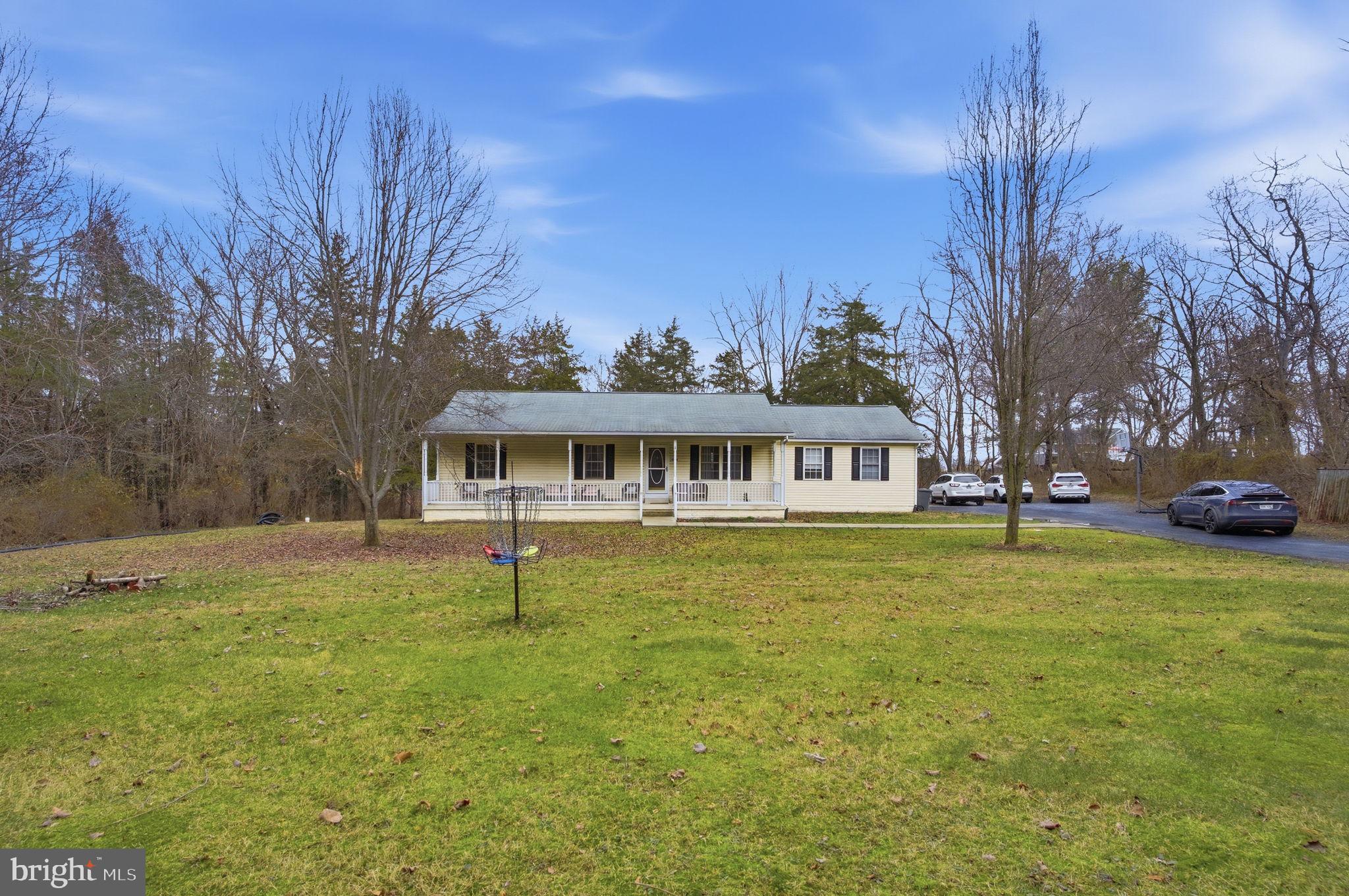 4624 Strasburg Road Strasburg, VA 22657 - Photo 2 of 31 a front view of a house with a yard