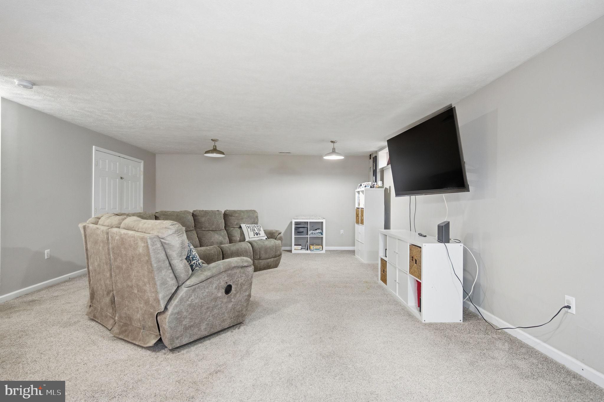 4624 Strasburg Road Strasburg, VA 22657 - Photo 21 of 31 a living room with furniture and a flat screen tv