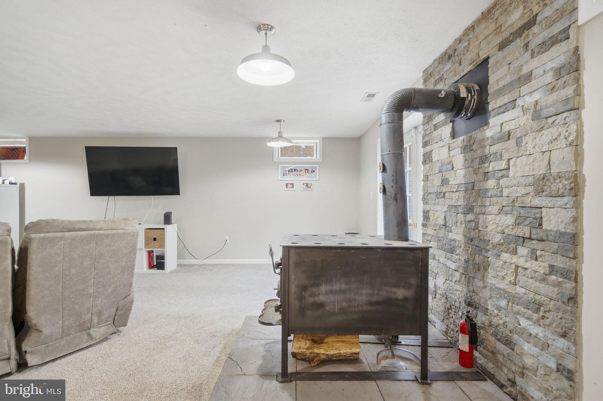 4624 Strasburg Road Strasburg, VA 22657 - Photo 23 of 31 a living room with furniture and a flat screen tv
