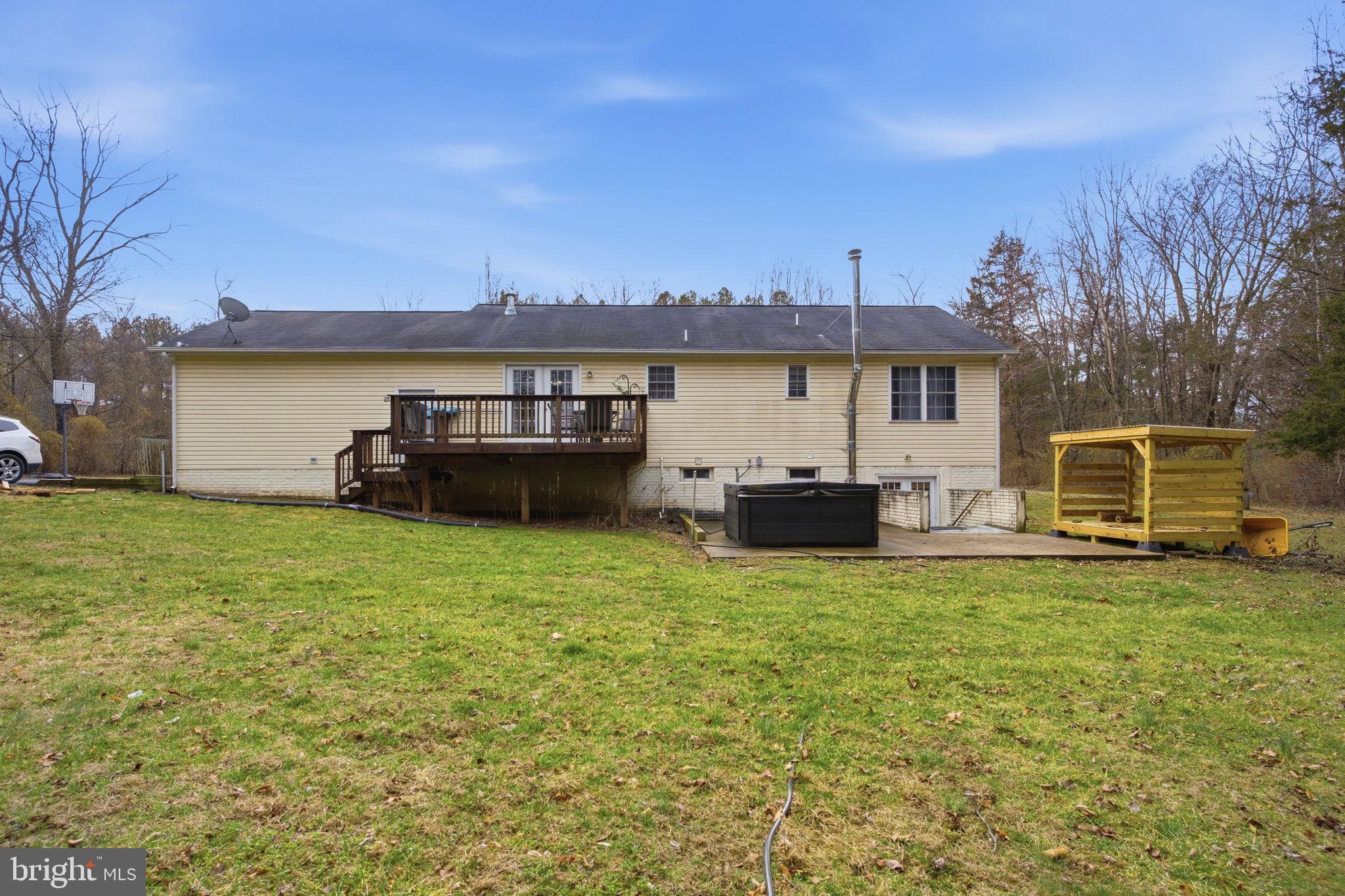4624 Strasburg Road Strasburg, VA 22657 - Photo 29 of 31 a view of a house with a big yard and a large tree