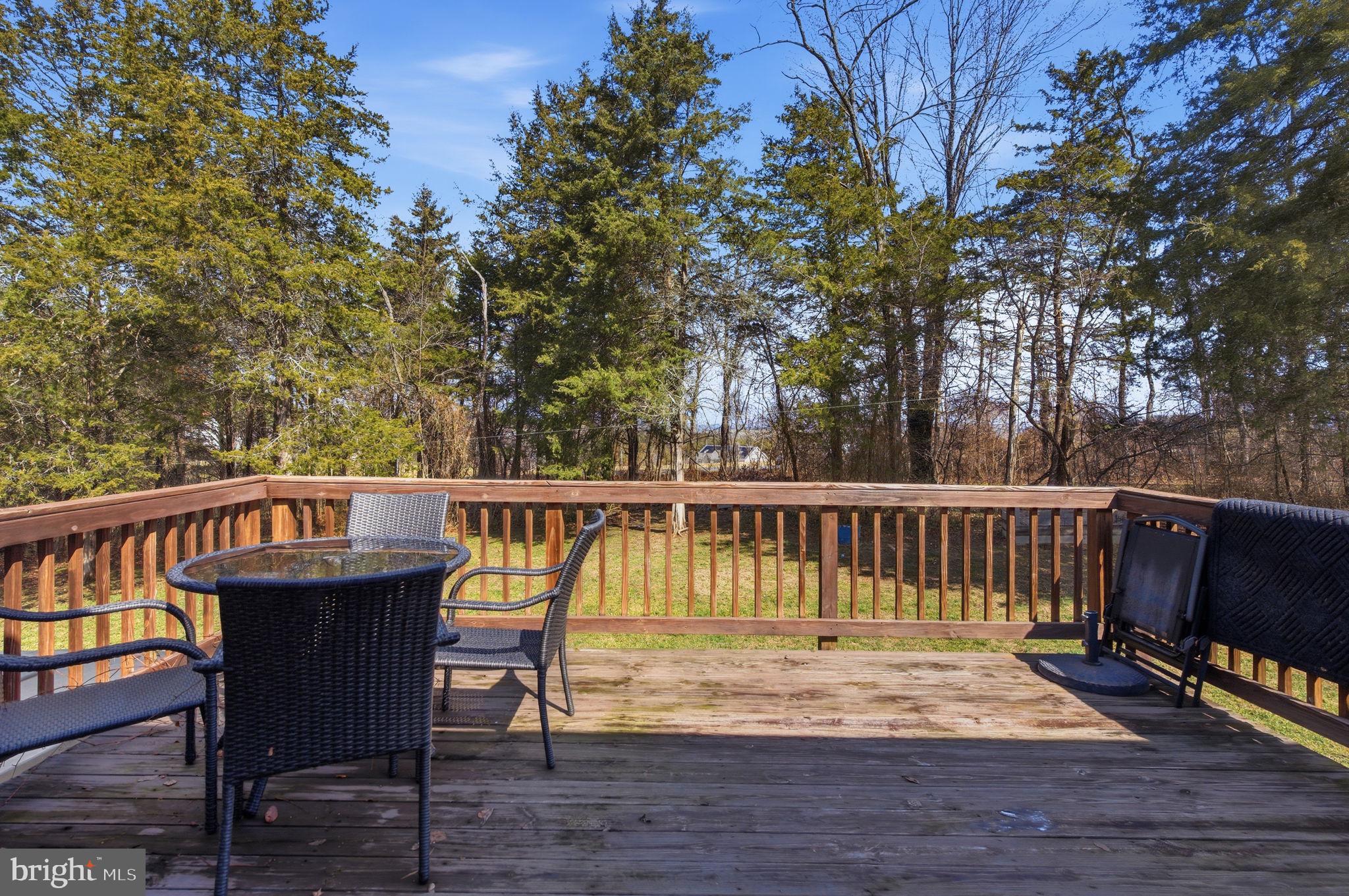 4624 Strasburg Road Strasburg, VA 22657 - Photo 31 of 31 a view of balcony with wooden floor and outdoor seating