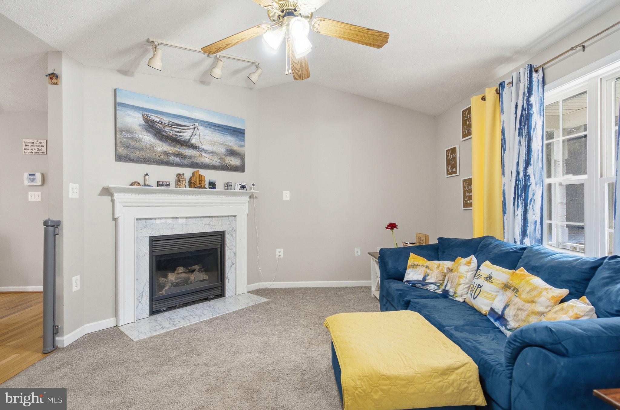 4624 Strasburg Road Strasburg, VA 22657 - Photo 6 of 31 a living room with furniture and a fireplace