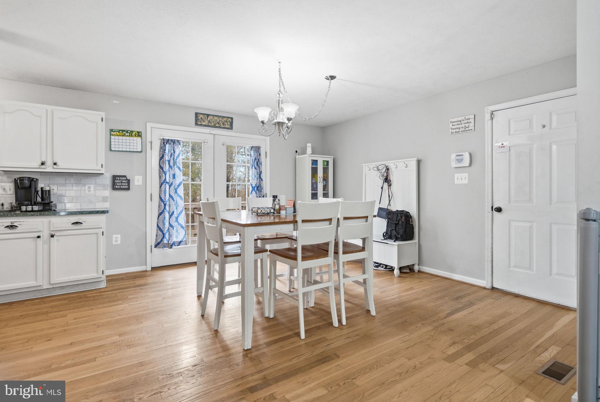 4624 Strasburg Road Strasburg, VA 22657 - Photo 7 of 31 a view of a dining room with furniture and wooden floor