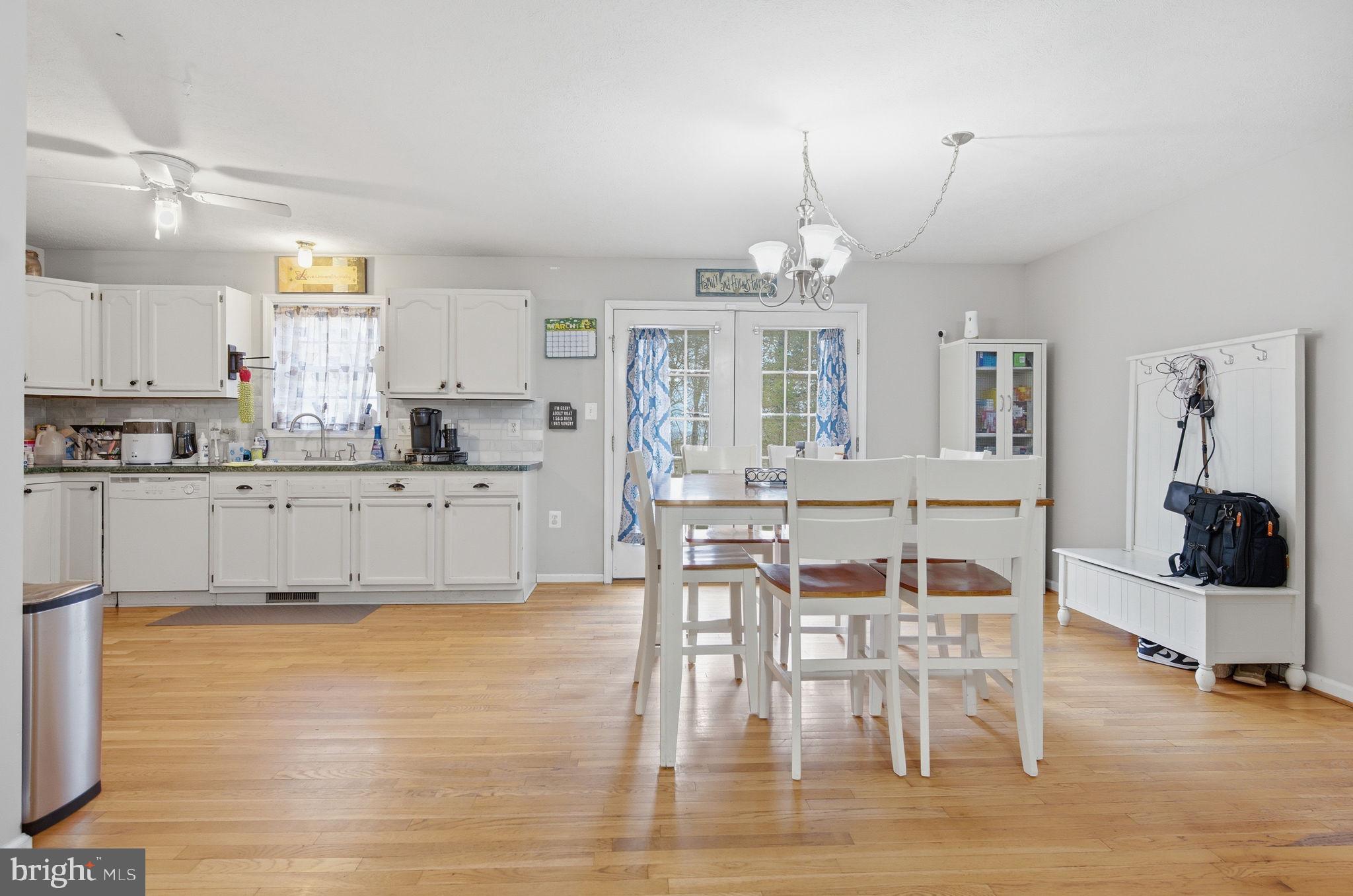 4624 Strasburg Road Strasburg, VA 22657 - Photo 8 of 31 a large kitchen with a table and chairs