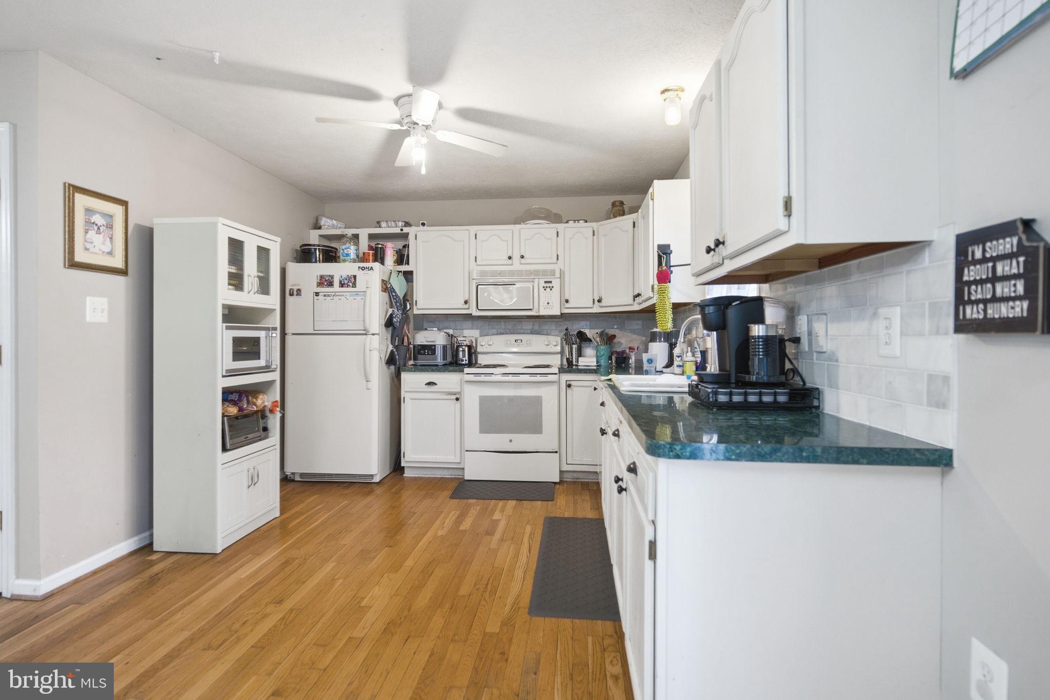 4624 Strasburg Road Strasburg, VA 22657 - Photo 10 of 31 a kitchen with stainless steel appliances granite countertop a refrigerator and a stove top oven