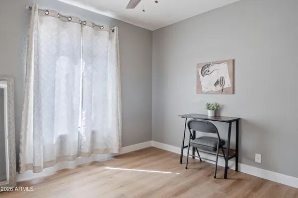 a view of a room with a table and chairs