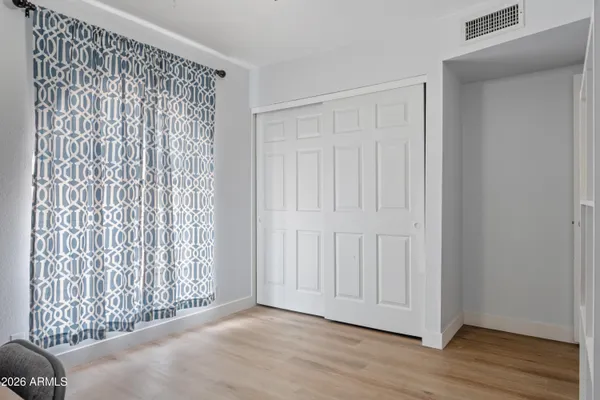 a view of entryway with wooden floor
