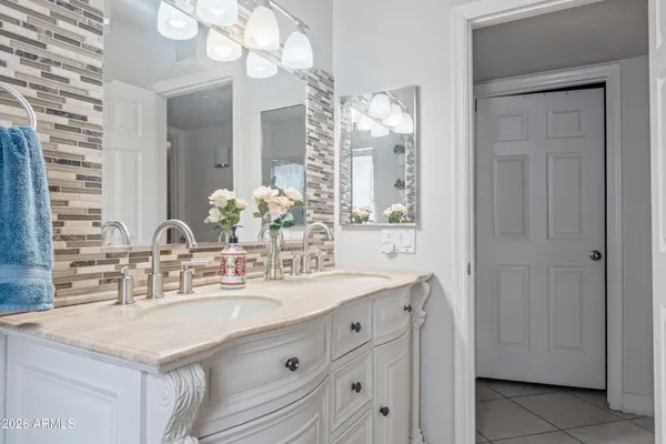 a bathroom with a sink vanity and a mirror
