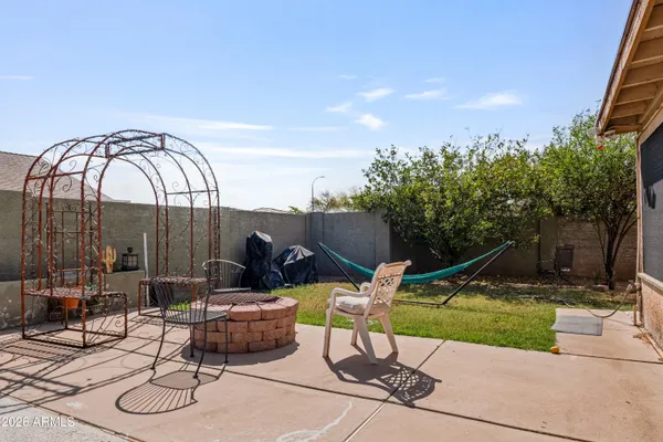 a view of a bench with a backyard