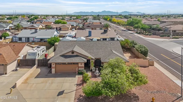 an aerial view of a house with a yard