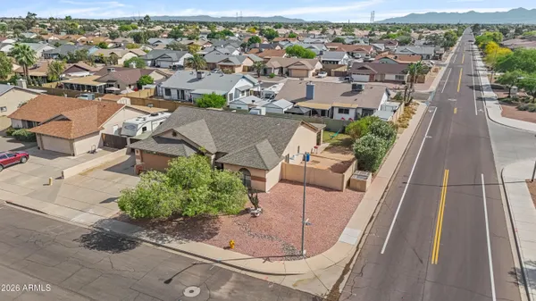 an aerial view of a house with a yard