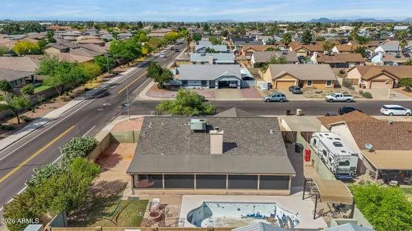 an aerial view of residential houses with outdoor space