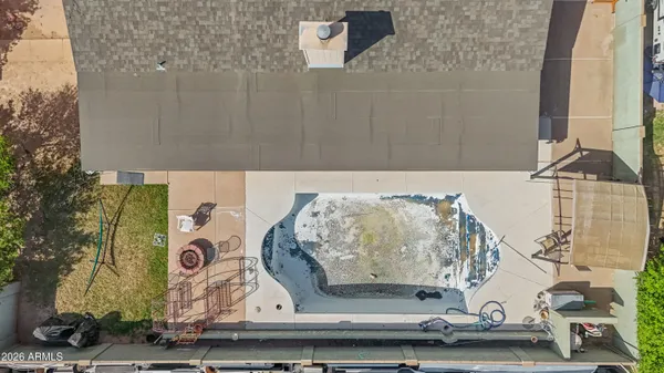 an aerial view of a house with yard