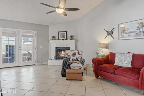 a living room with furniture and a fireplace
