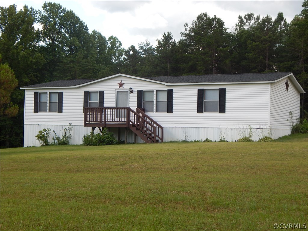 5733 Broad St Road Kents Store, VA 23084 - Photo 1 of 21 a front view of a house with a garden