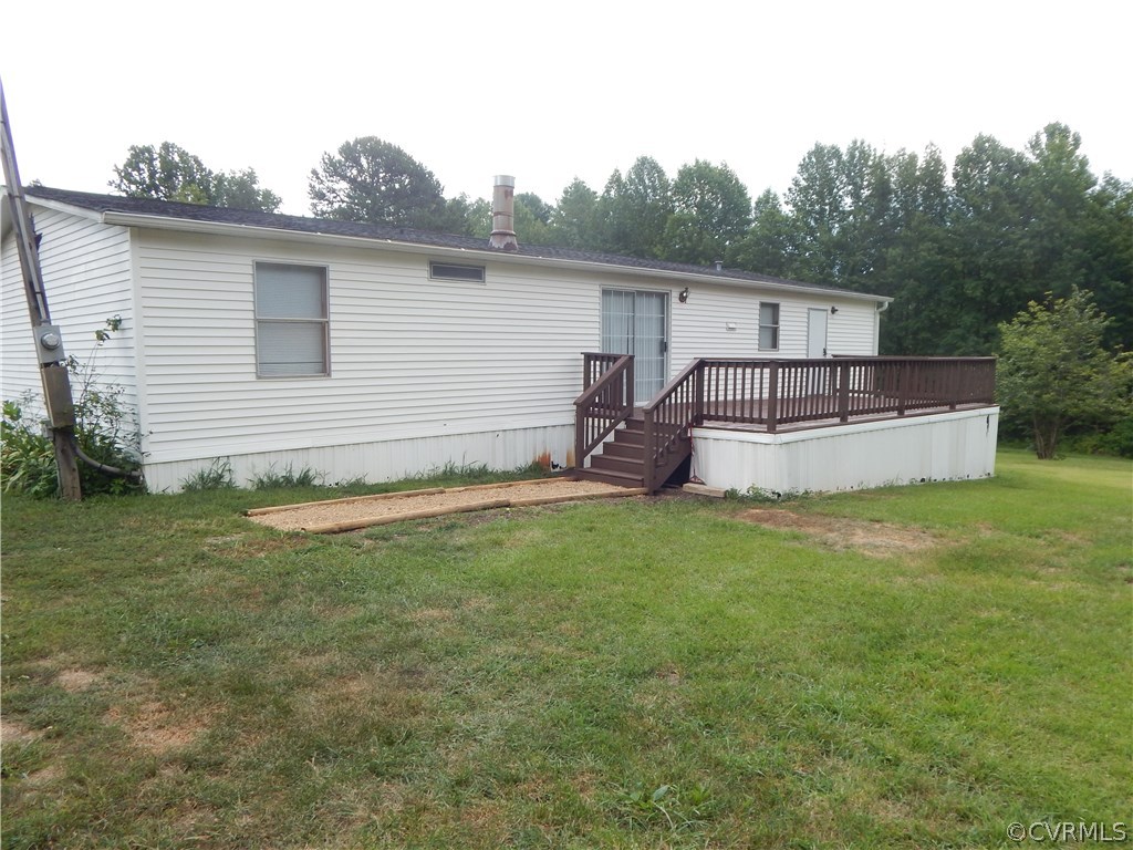 5733 Broad St Road Kents Store, VA 23084 - Photo 20 of 21 a backyard of a house with table and chairs