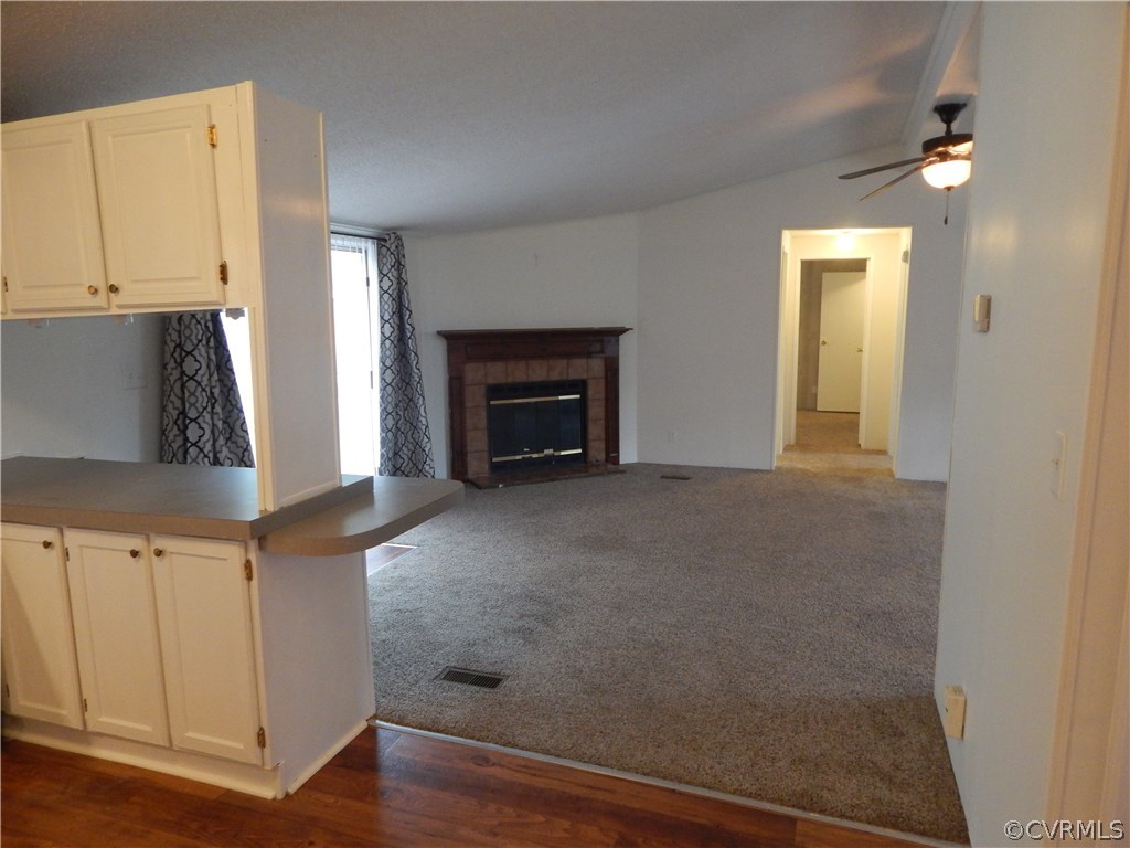 5733 Broad St Road Kents Store, VA 23084 - Photo 6 of 21 a view of a kitchen with an empty space and a fireplace
